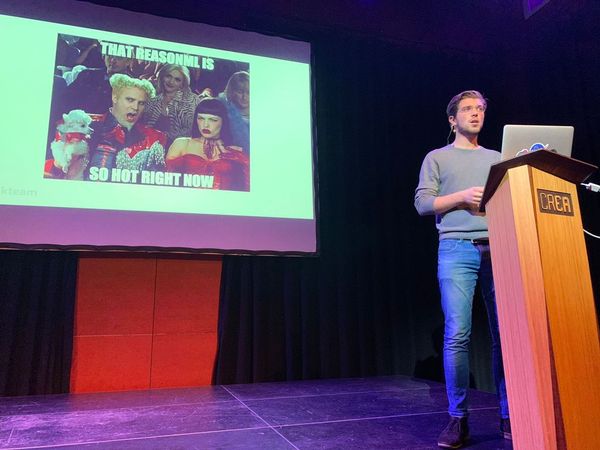 Roy Derks introducing ReasonML on stage at React Amsterdam in 2018