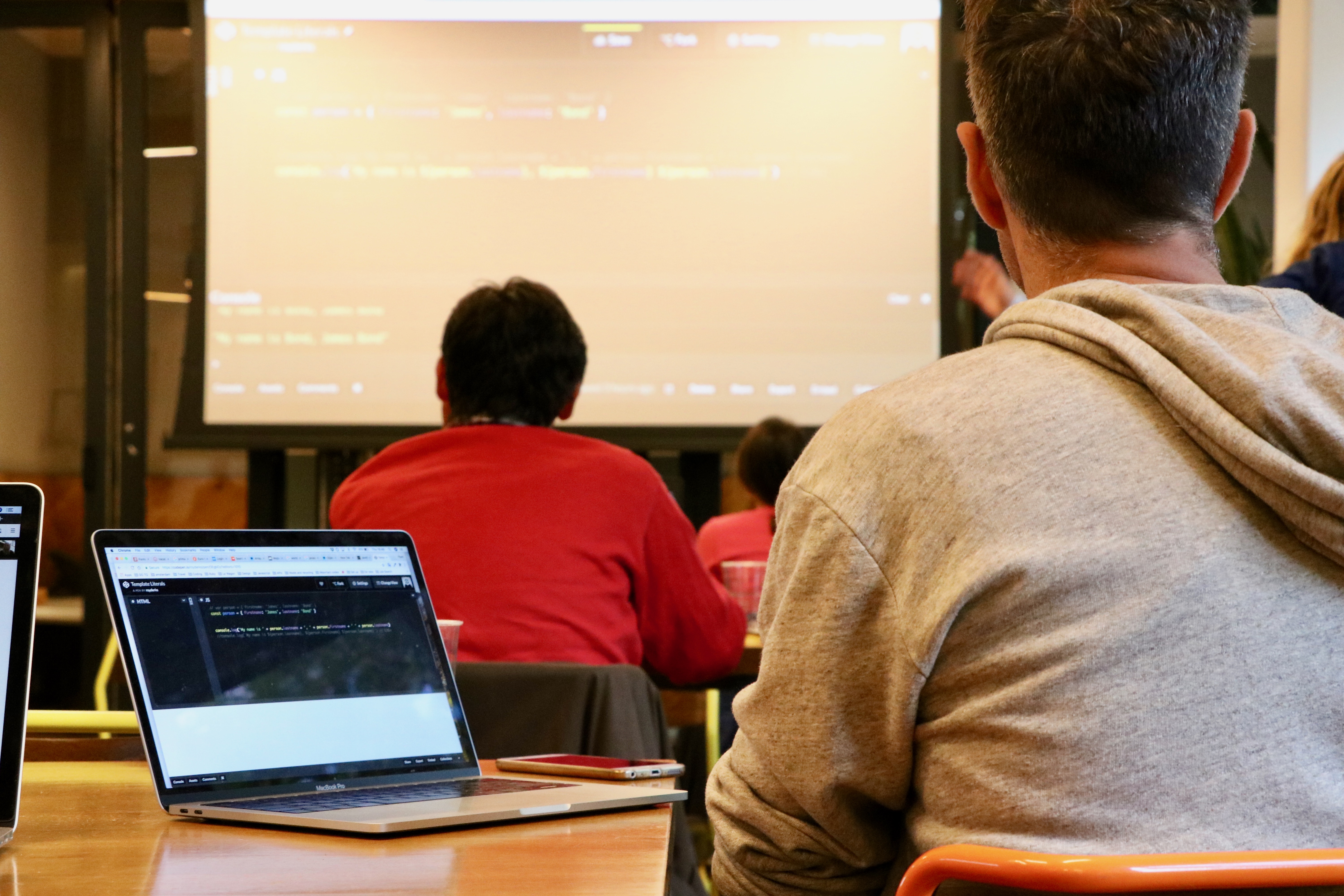 Participants following JavaScript coding exercises at WeWork Amsterdam in June 2018