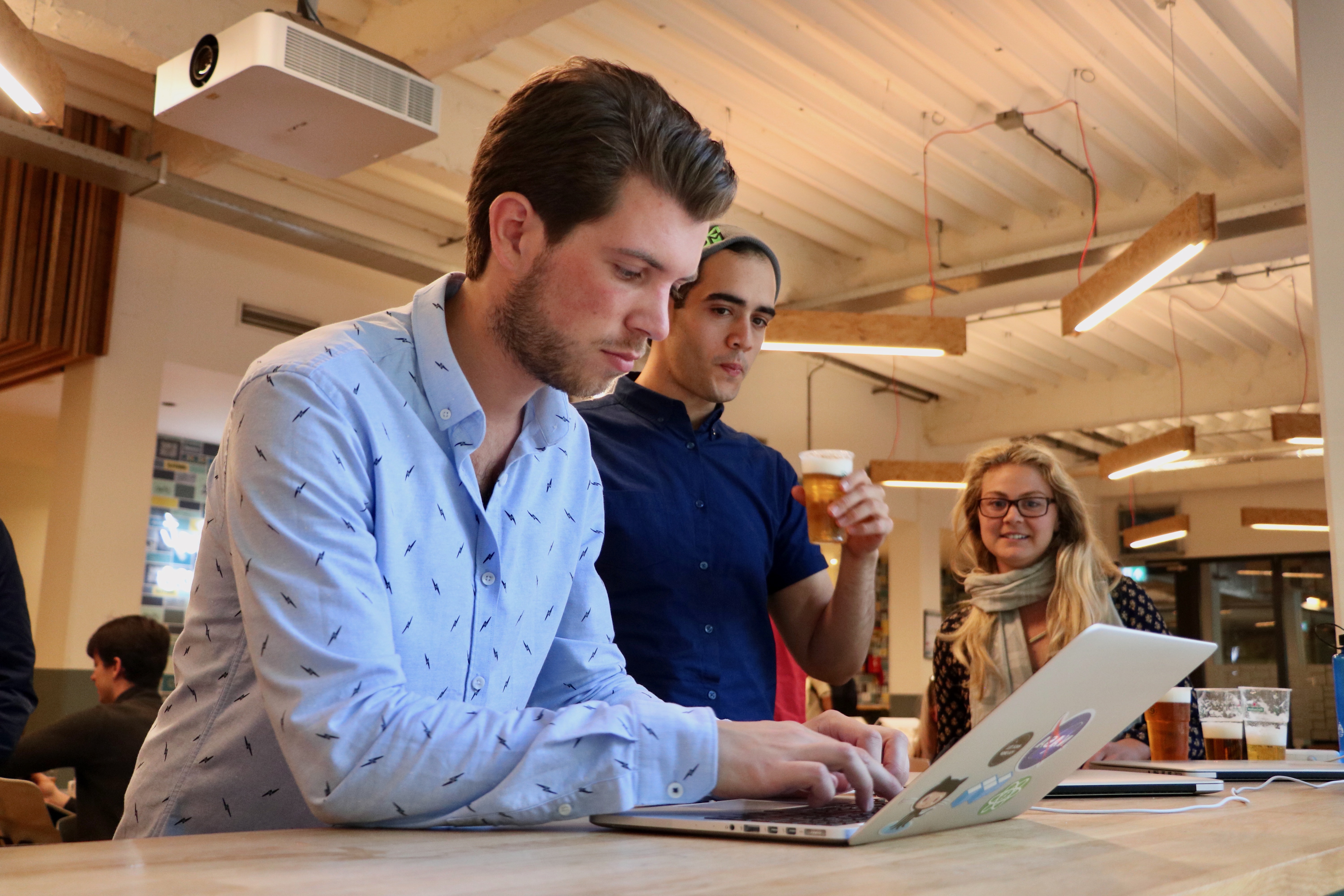 Roy Derks helping participants with JavaScript at the WeWork Amsterdam workshop in June 2018